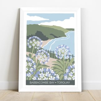 frame of Babbacombe Bay in Torquay with agapanthus flowers