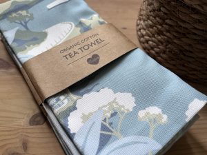 tea towel featuring illustration of Anstey's Cove in Torquay, Devon